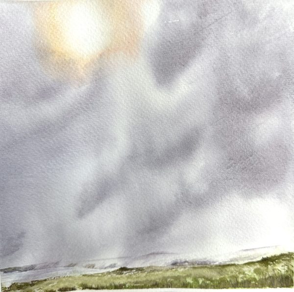 clouds blowing in from the sea over a small section of landscape in Scarborough